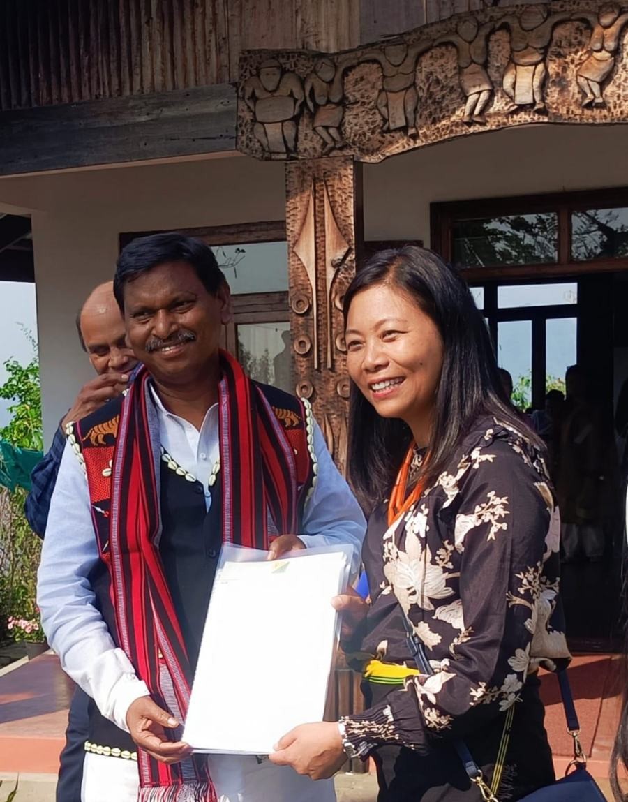 Union Minister of Tribal Affairs, Arjun Munda and YouthNet Founder, Hekani Jakhalu Kense during the visit to Van Dhan Vikas Kendra (C) in Tuophema/Botsa under Kohima district on April 26.